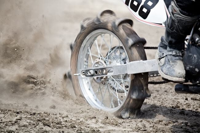 Paddle dirt bike tire in sand