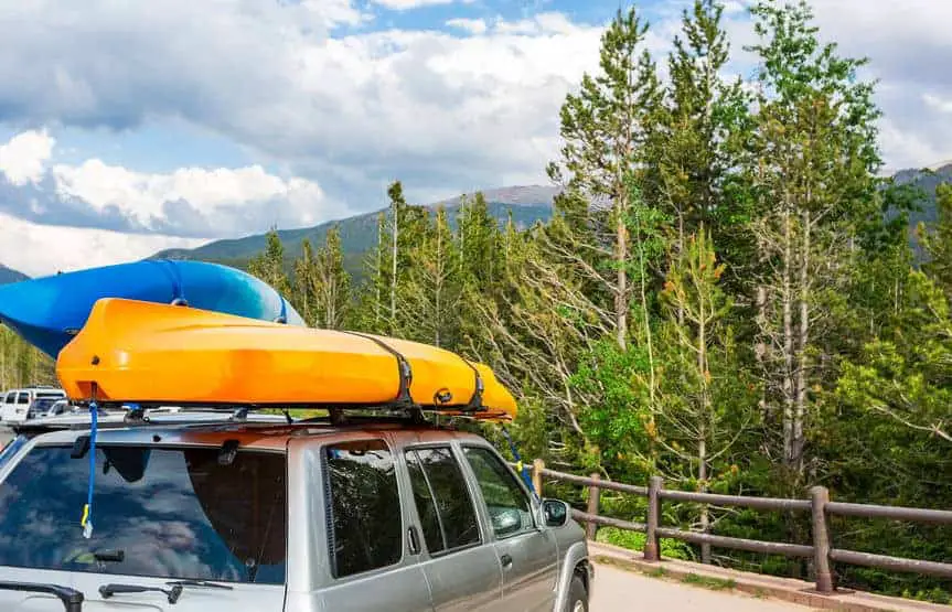 kayaks on top of an SUV